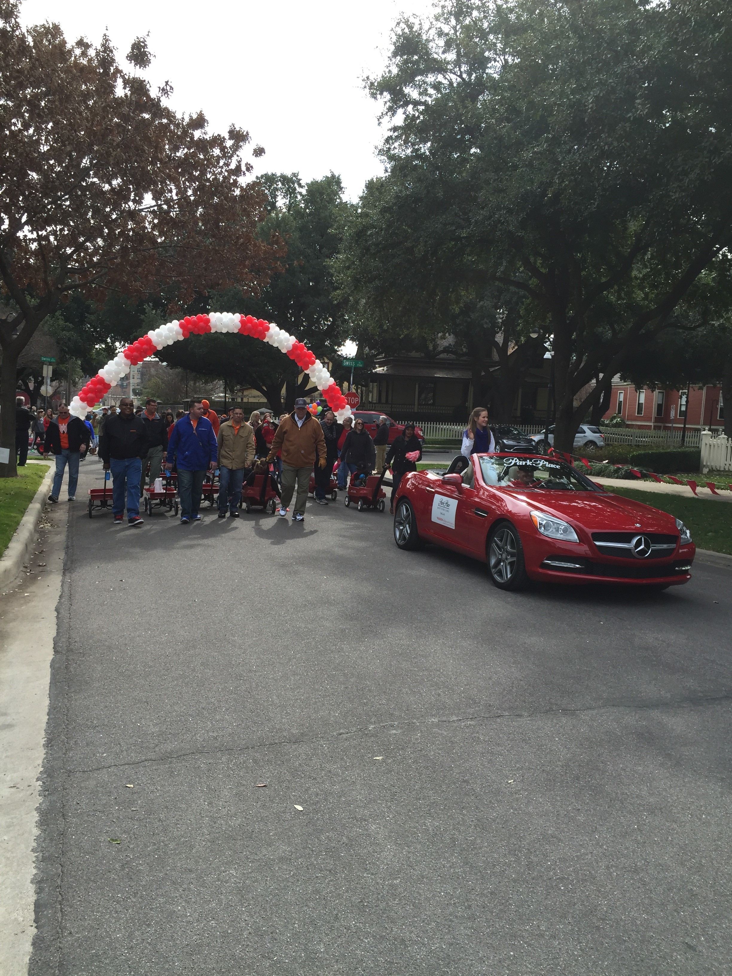 Mercedes-Benz convertible in A Wagon Holds a Promise parade